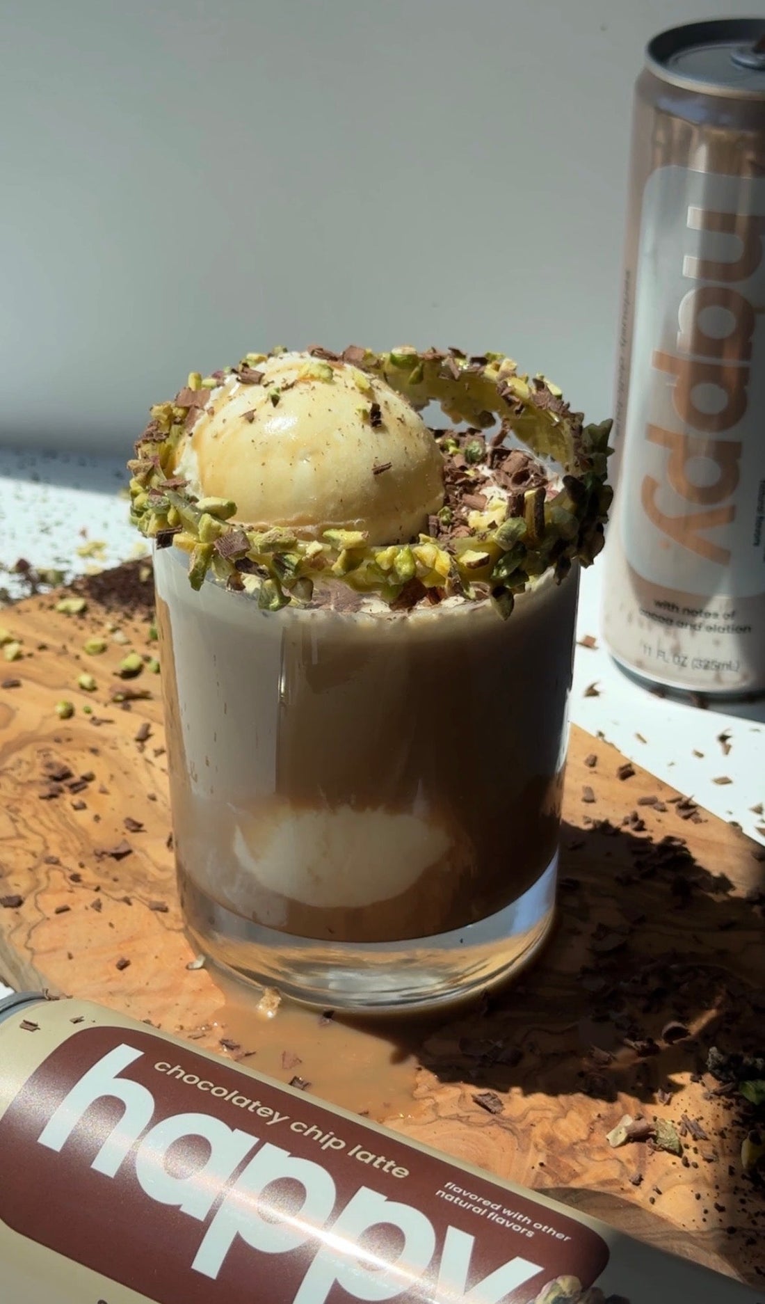 Dubai chocolate affogato float — vanilla ice cream with happy products Dubai chocolatey style latte poured over, garnished with pistachios and chocolate syrup
