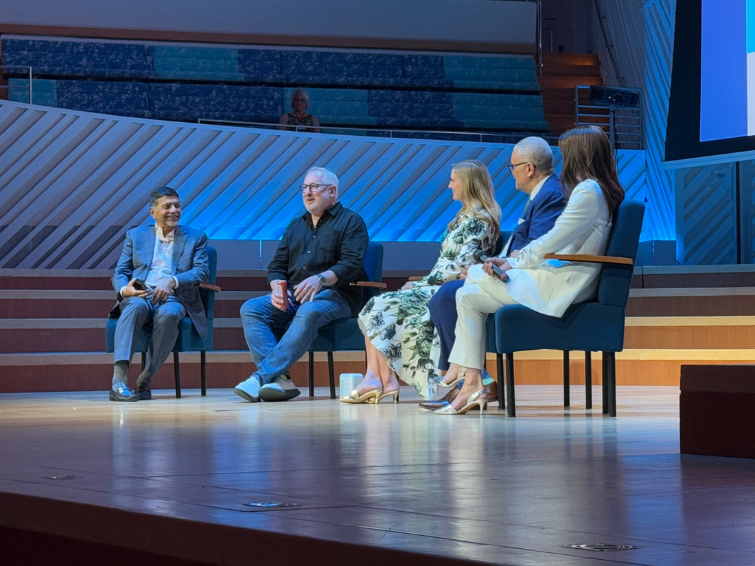 Photo of Craig on stage at the World Happiness Summit in Miami