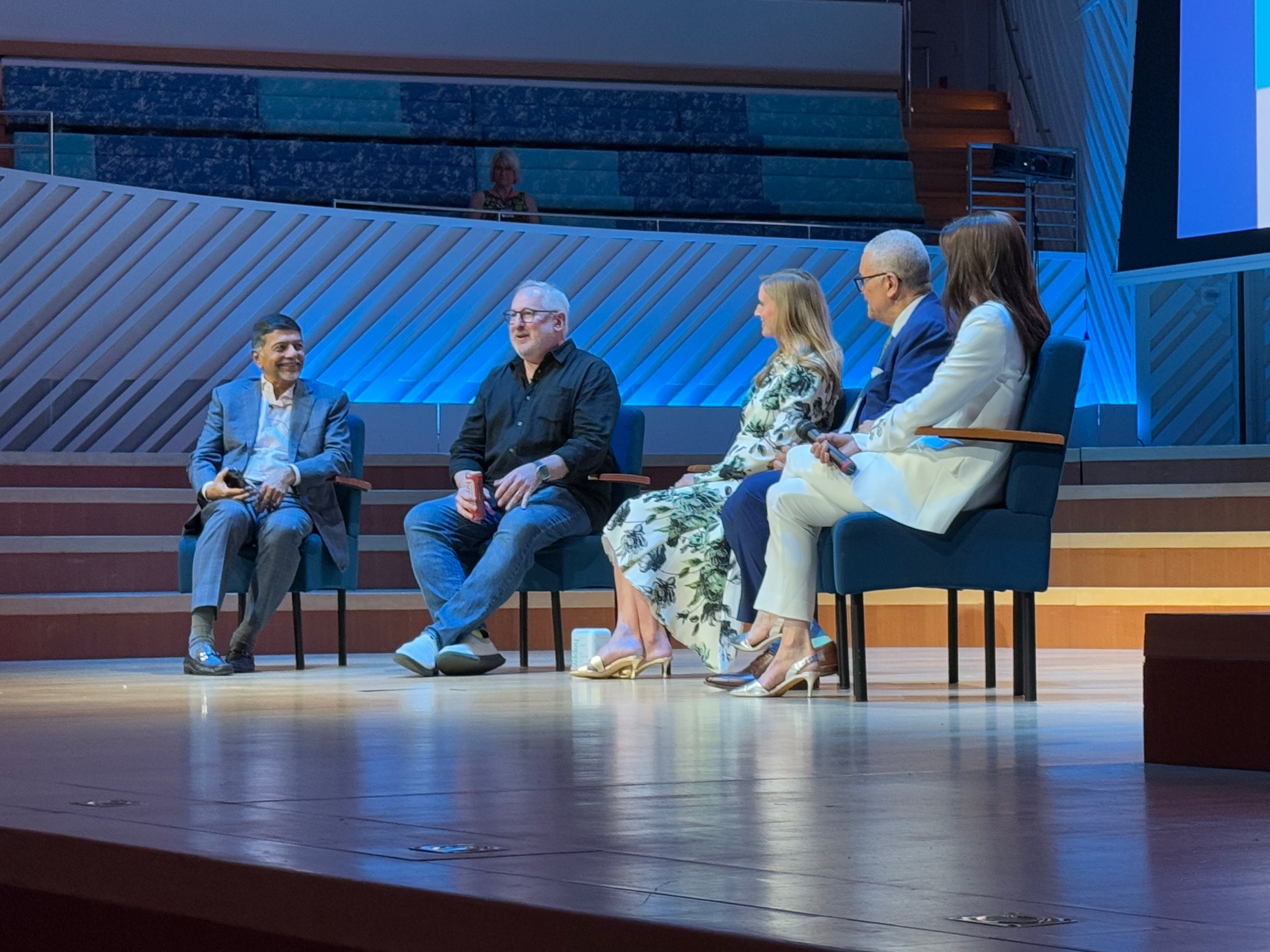 Photo of Craig on stage at the World Happiness Summit in Miami