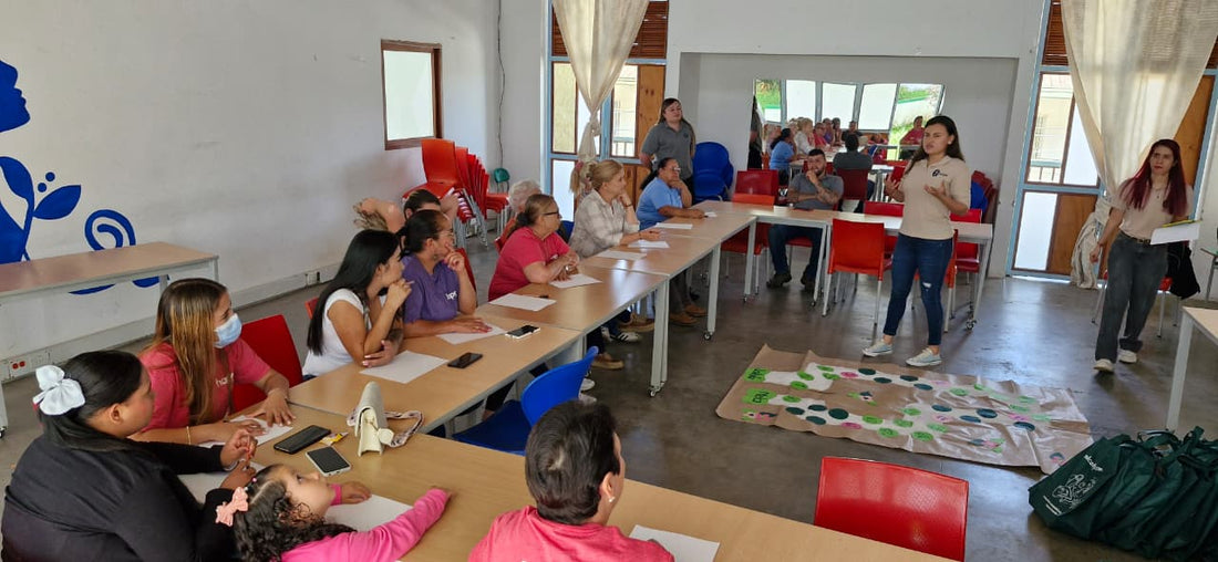 farmers in Colombia sitting at a table listening to a speaker