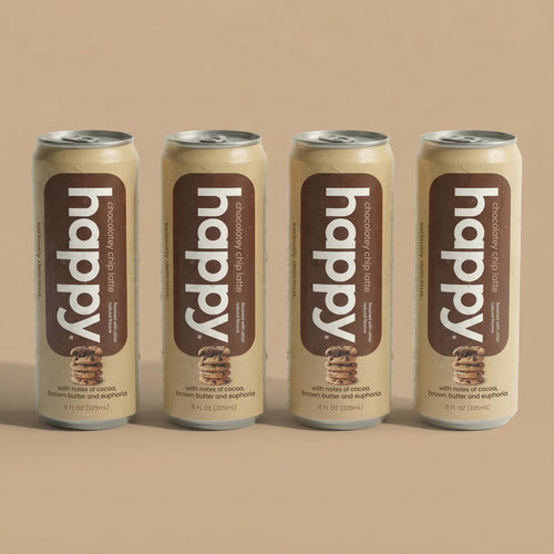 Four cans of 'happy' chocolate chip Latte on a beige background