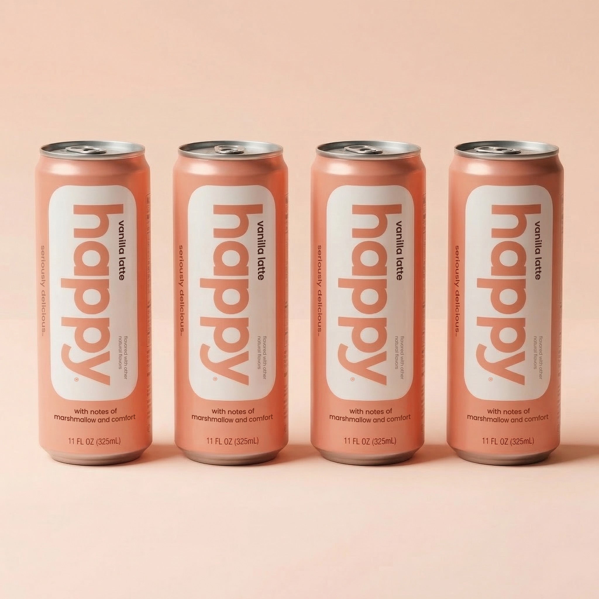 Four cans of 'happy' vanilla latte on a peach background