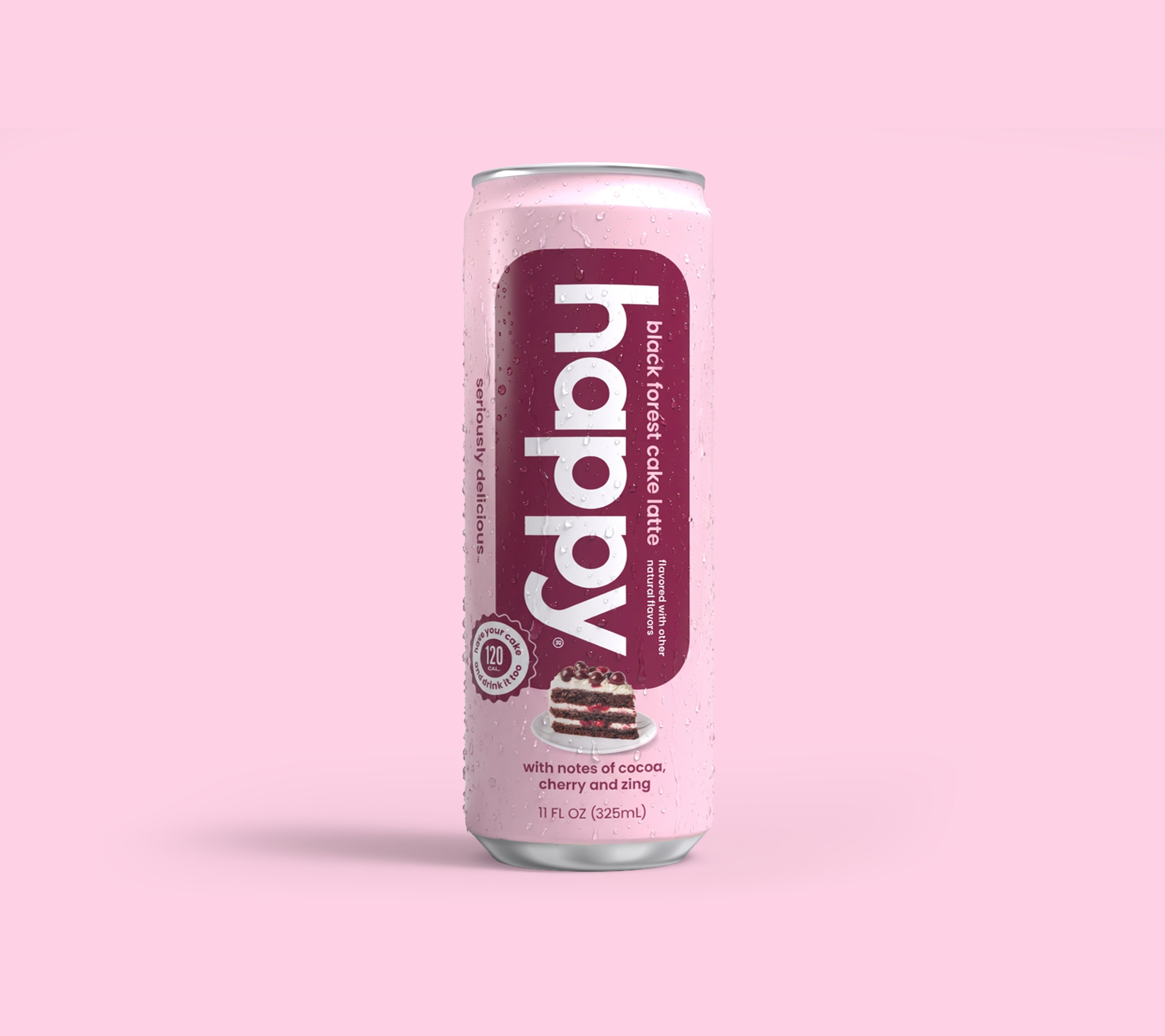 Bottle of 'happy' black forest cake latte on a pink background