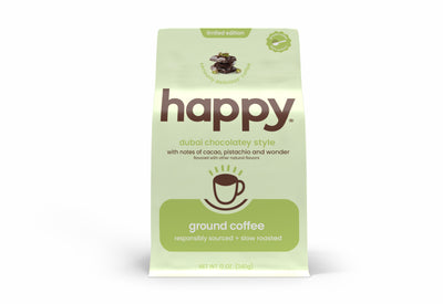 Green package of 'happy' dubai chocolatey style ground coffee on a white background