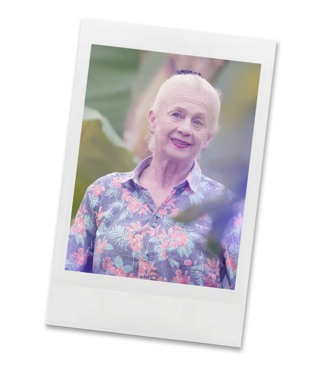 Polaroid-style photo of a person wearing a floral shirt with a blurred background