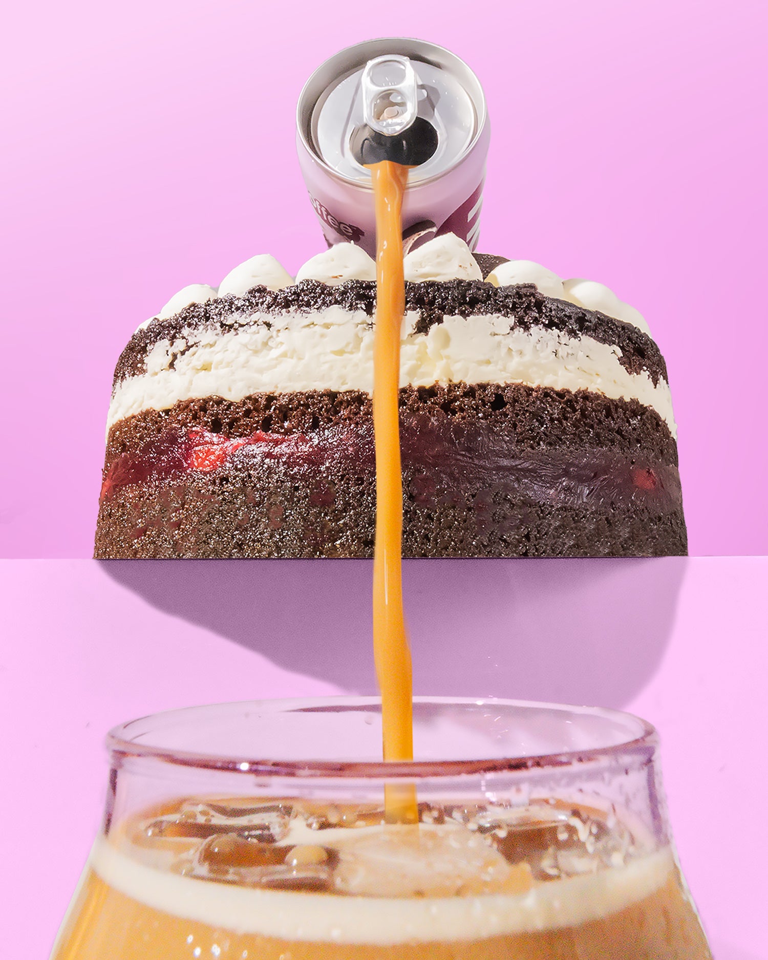 Layered cake with a can of coffee being poured into a glass of iced coffee on a pink background