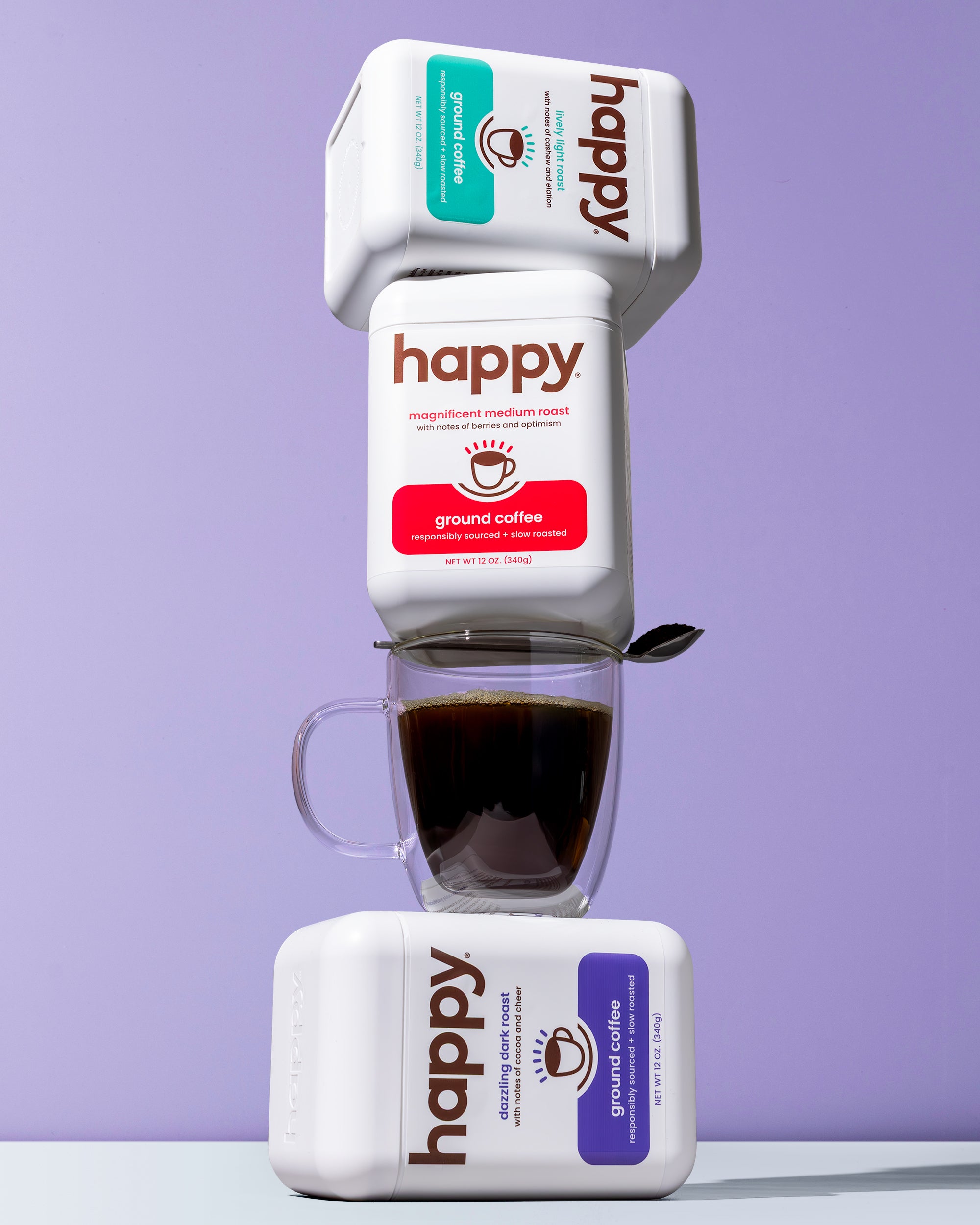 Happy coffee packaging with a cup of coffee on a purple background