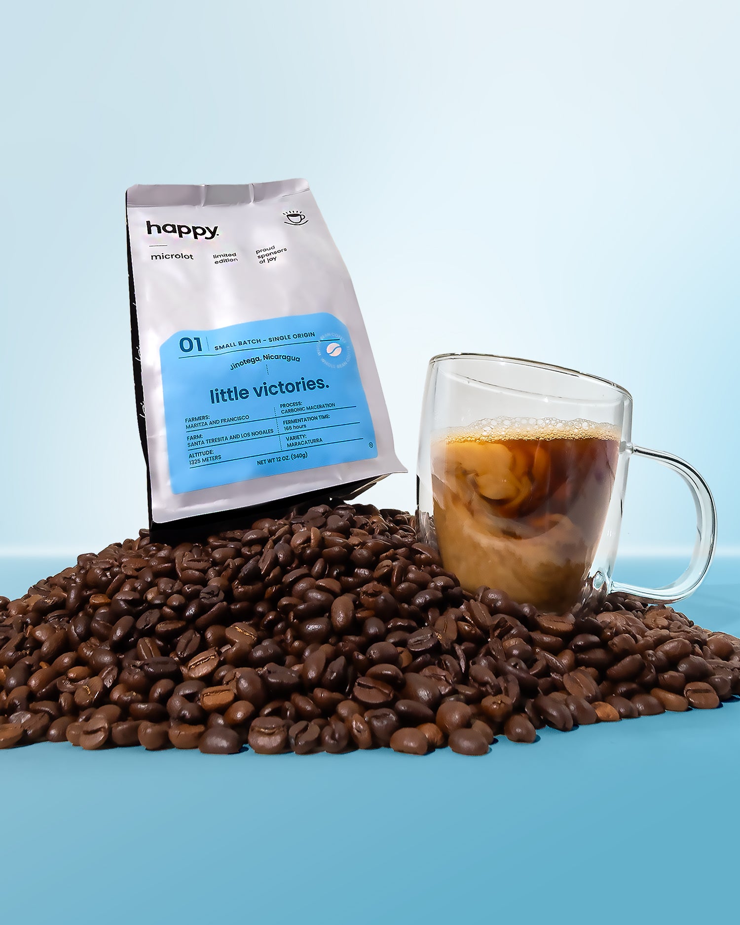 Happily roasted coffee beans with a glass of coffee and a bag of high quality coffee on a blue background