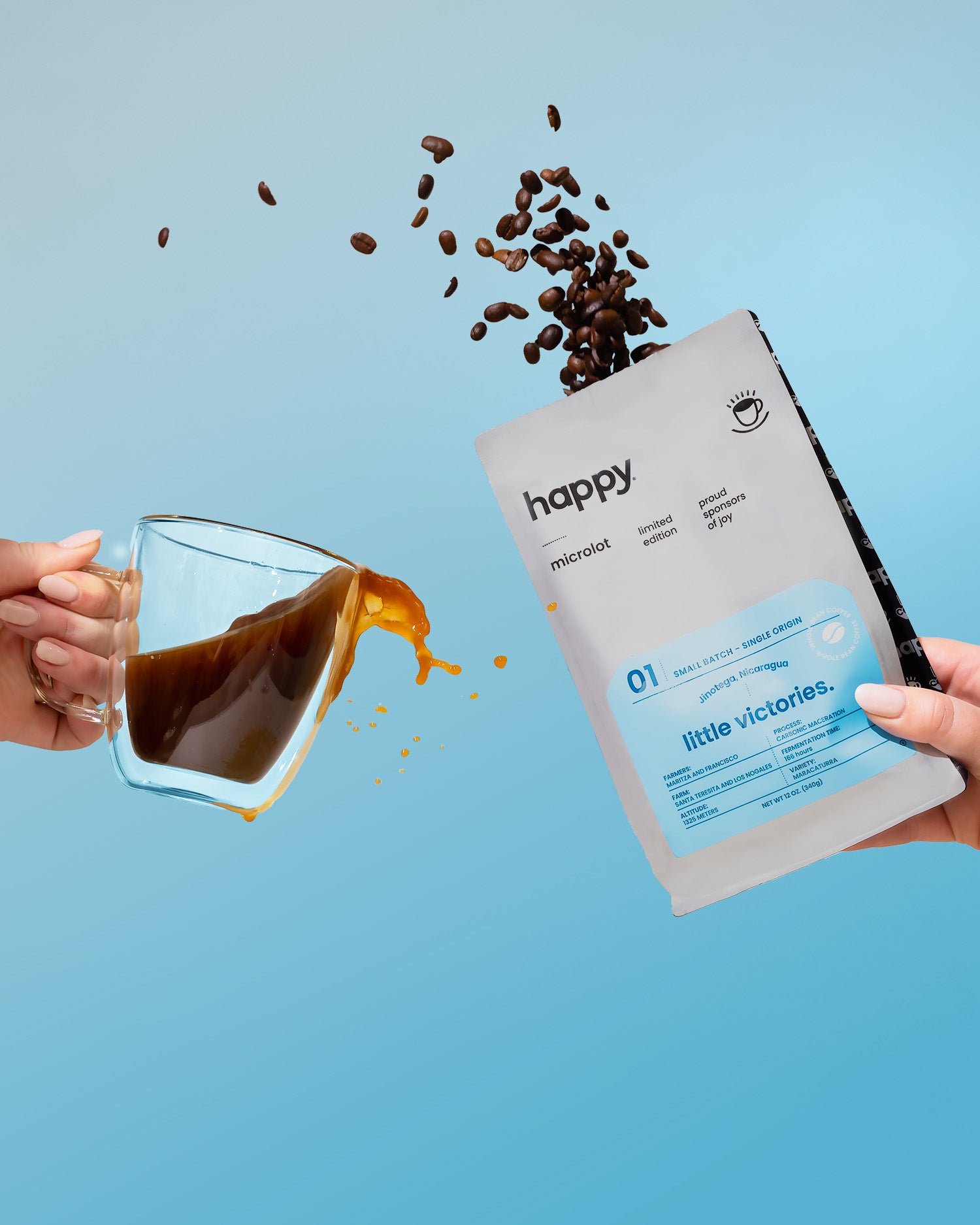 Coffee beans spilling from a glass mug into a 'happy' branded coffee package against a blue background