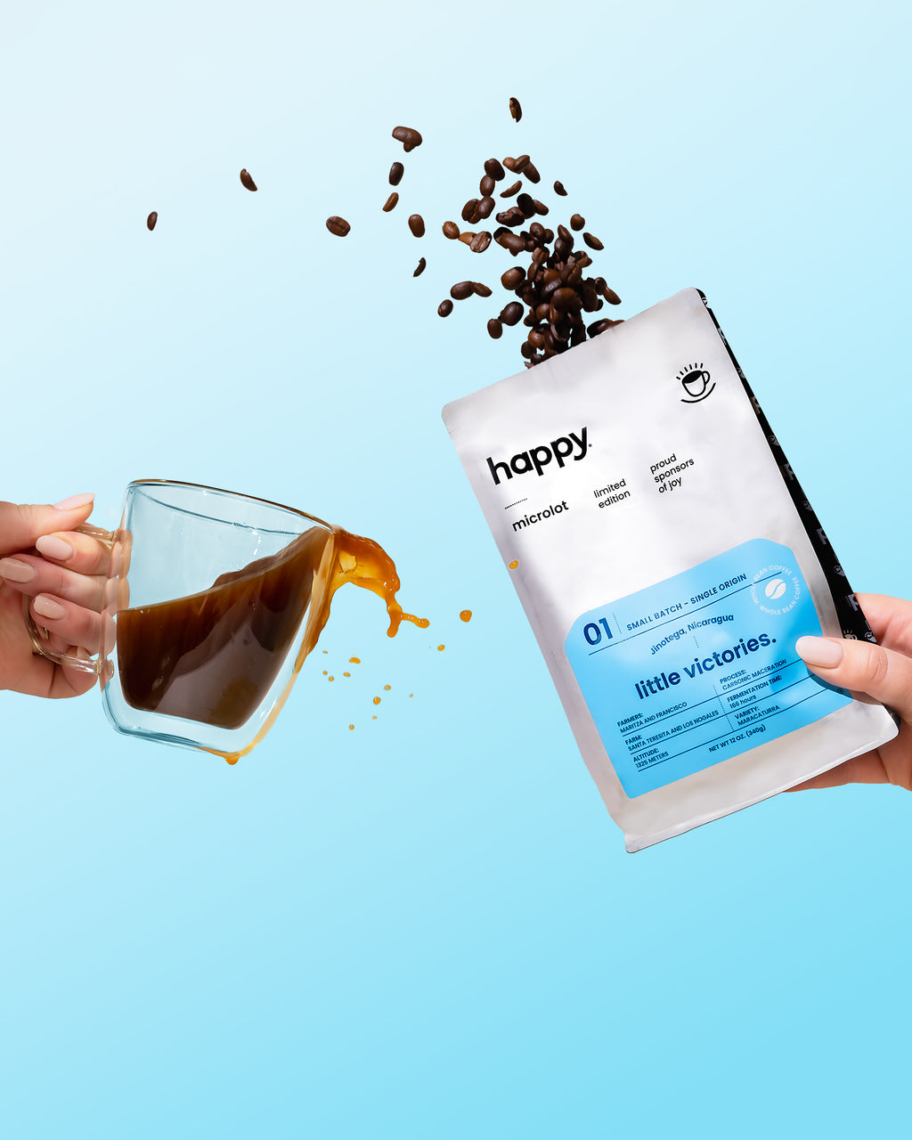 Coffee beans spilling from a glass mug into a 'happy' high quality specialty coffee package against a blue background