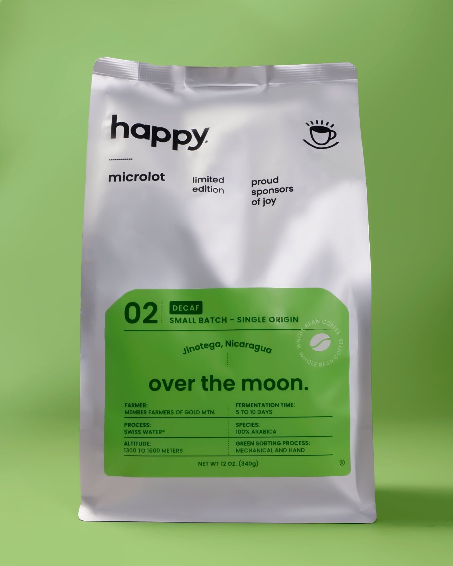 Over the Moon Decaf Coffee bag from happy on a green background