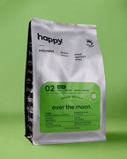 Over the Moon Decaf Coffee bag from happy on a green background
