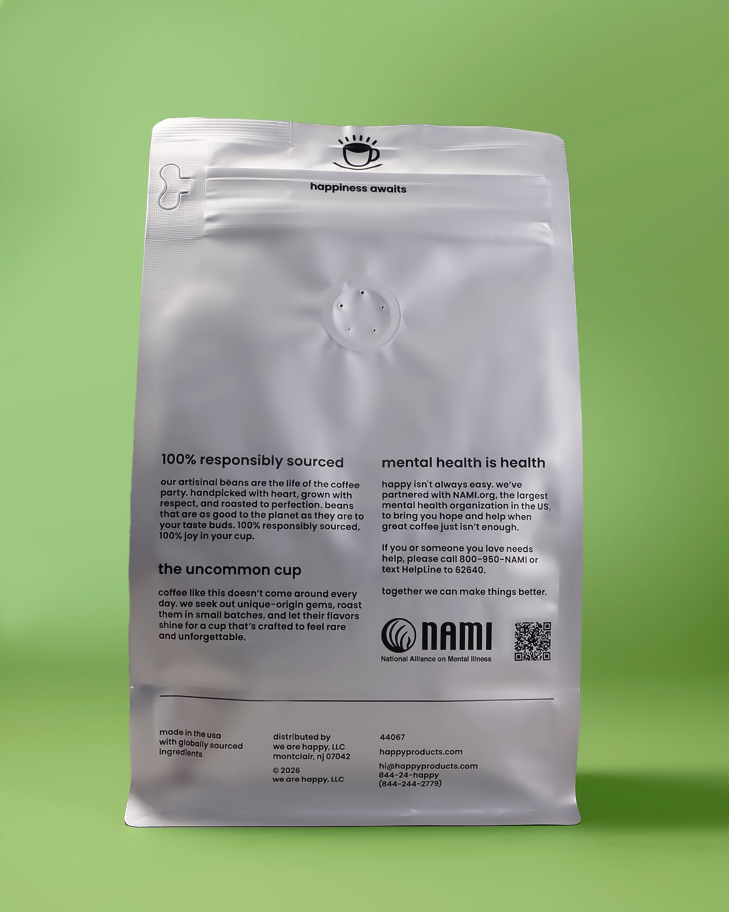 Over the Moon Decaf Coffee bag from happy back of pack on a green background