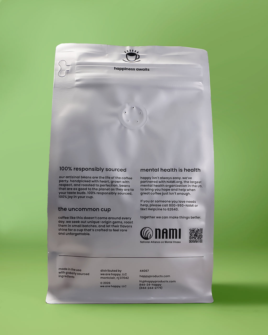 Over the Moon Decaf Coffee bag from happy back of pack on a green background