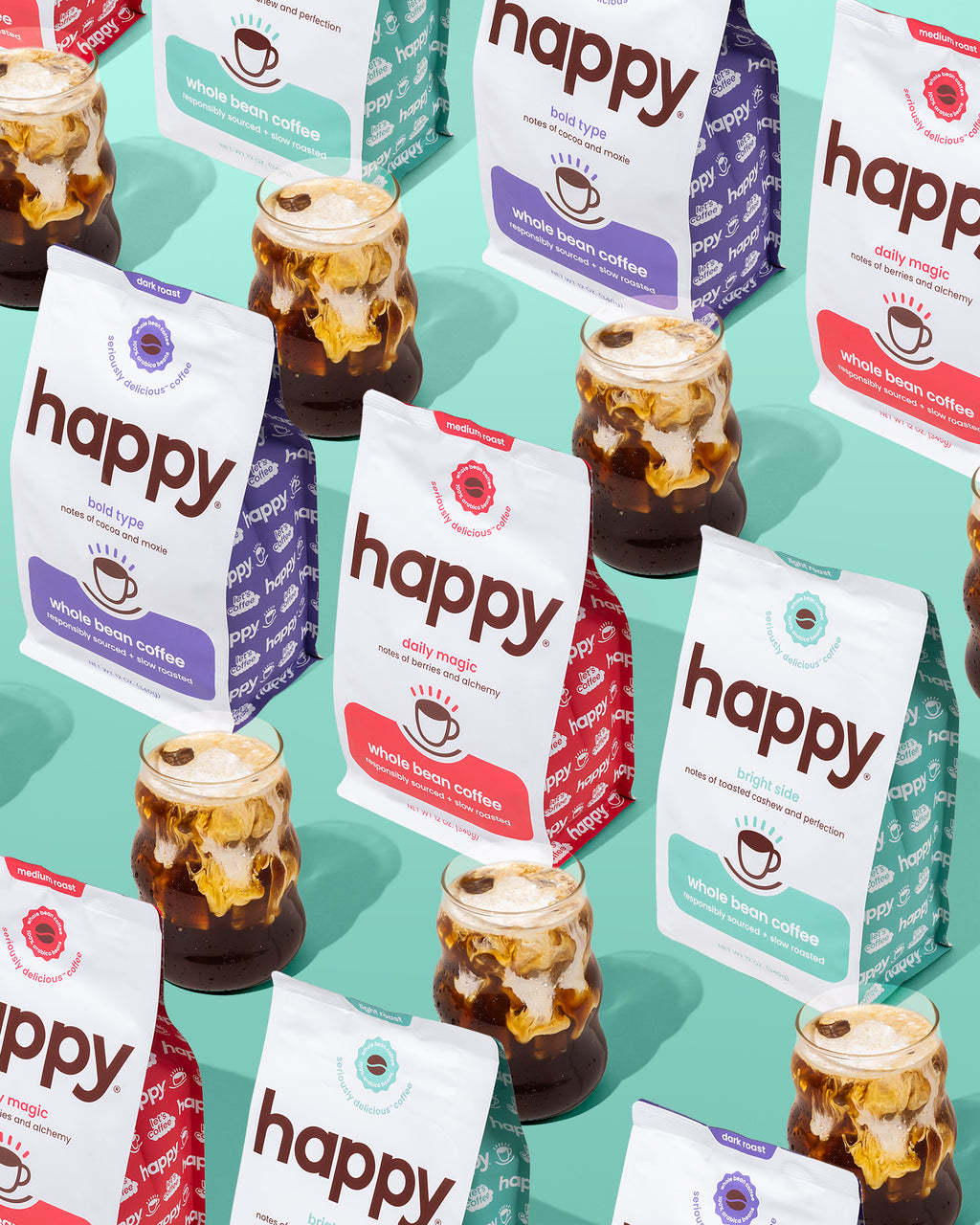 Multiple 'happy' branded coffee packages with jars of iced coffee on a teal background