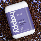 dazzling dark roast whole bean on a bed of coffee beans
