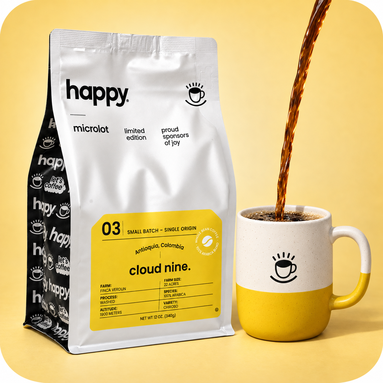 A bag of Happy Microlot Cloud Nine coffee beans stands next to a yellow and white ceramic mug with coffee being poured into it, set against a solid pale yellow background.