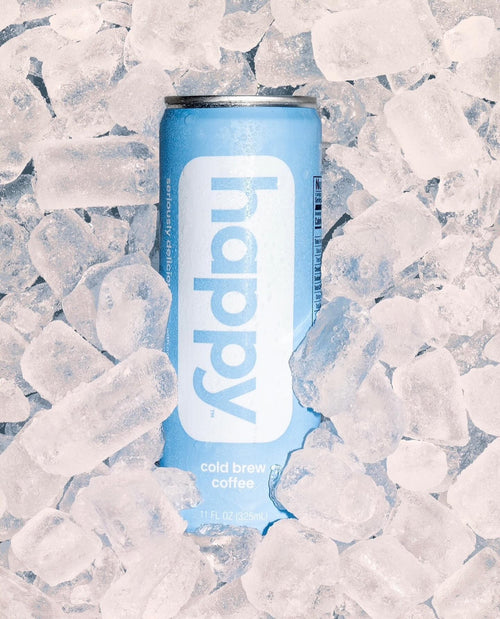 Can of 'happy' cold brew coffee surrounded by ice cubes