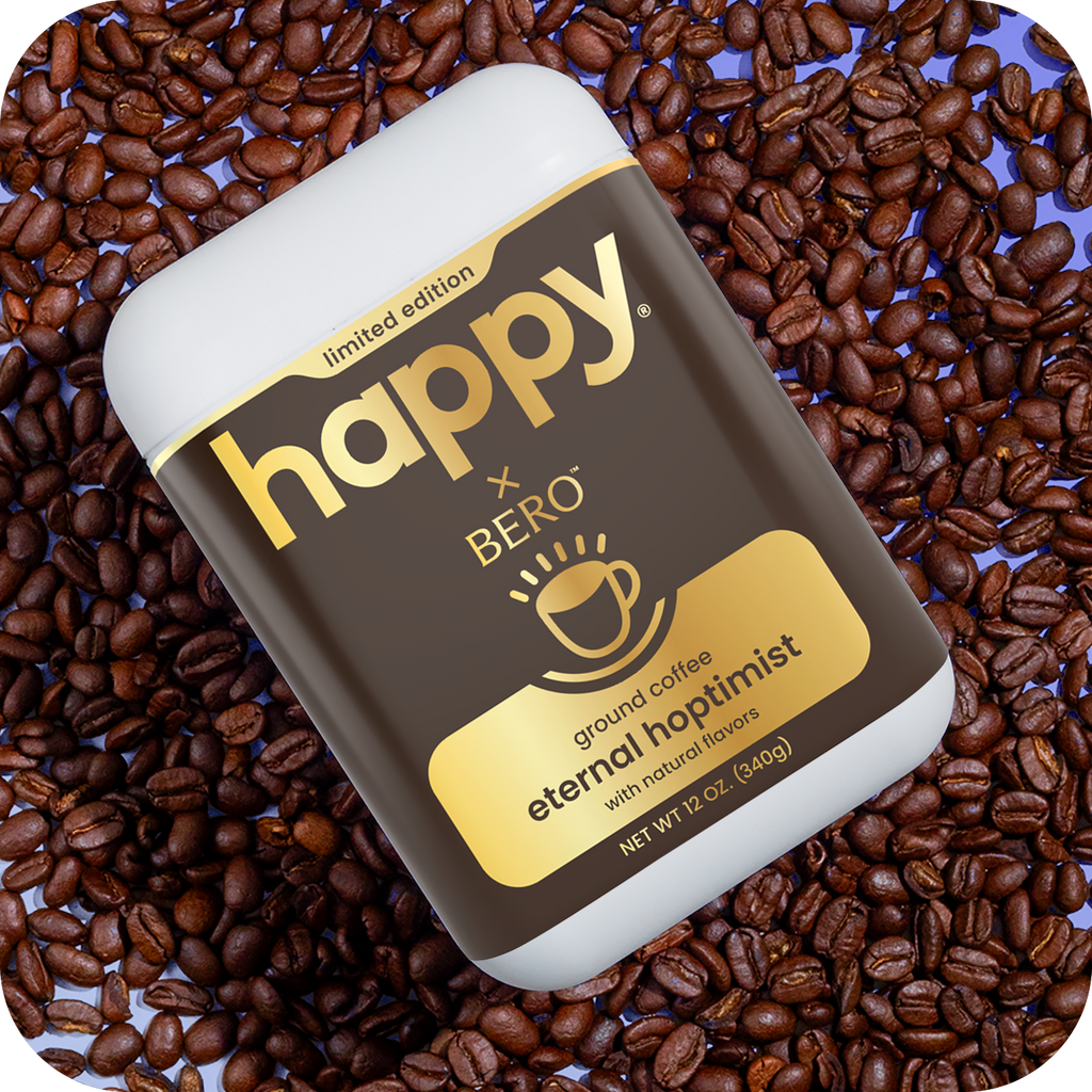 happy x BERO eternal hoptimist ground coffee container on a bed of coffee beans